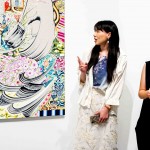 From left to right: Mizuno Rina (artist) with Lim Sim Lin (translator) explaining about her work, Mansion in a Mountain Range, 2019, oil on canvas, 162 × 130 cm, © Mizuno Rina, courtesy of Mizuma Gallery