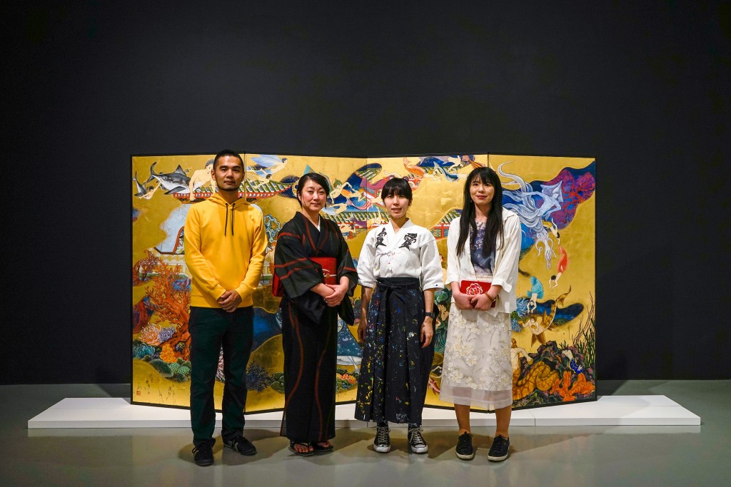 From left to right: Kobayashi Satoshi (artist), Kimura Ryoko (artist), Kato Ai (Ai☆Madonna) (artist), and Mizuno Rina (artist), standing in front of Kimura Ryoko’s The Sea of the Enchanted City - Paradise of Dragon Palace, 2016, © Kimura Ryoko, courtesy of Mizuma Gallery